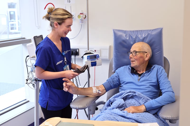 Pat Molloy with nurse Ella Sweeney on one of his regular visits to St Vincent’s University Hospital, Dublin, where he receives ongoing care. Photograph: Dara Mac Dónaill/The Irish Times