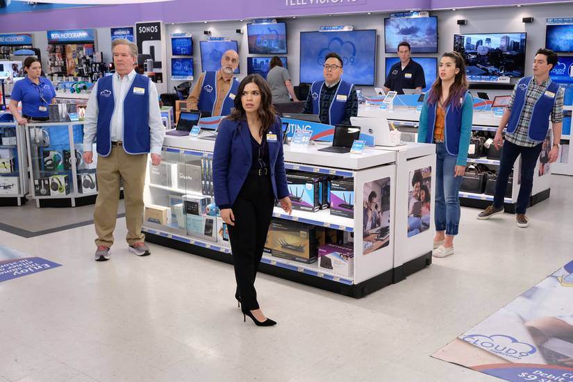 Tthe cast of Superstore gathers around a bunch of TVs, mouths agape