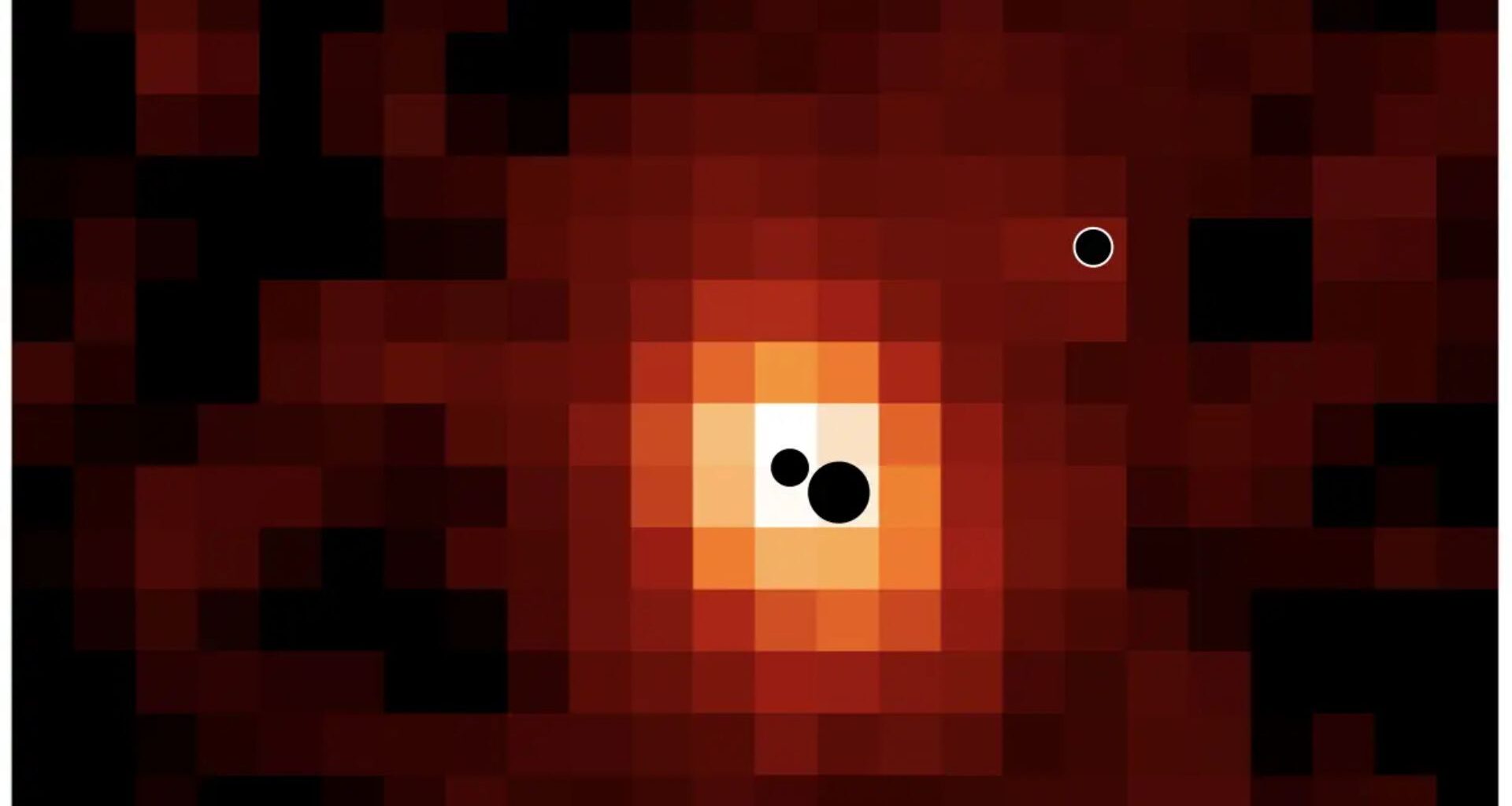 A pixelated reddish image. There are three black circles showing where the three black holes are located.