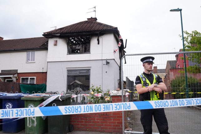 Police officers at the scene on Birchington Avenue, Grangetown, near Middlesbrough, where Valentina Foster, aged seven, and Natalie McDonald, 34, died following a fire at an end-of-terrace property on Wednesday morning. Police are not ruling out a possible link between the fatal house fire and a crash on the A66 less than two miles away that killed seven people. Picture date: Thursday August 27, 2026. PA Photo. Cleveland Police said two men, aged 23 and 31, have been arrested on suspicion of murder and they remain in police custody following the fire. Photo credit should read: Owen Humphreys/PA Wire