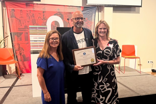 Content magazine founder Daniel Garcia, center, holds a commendation from Santa Clara County, with former SV Creates CEO Connie Martinez, left, and current SV Creates CEO Alexandra Urbanowski at the San Jose Museum of Art on Thursday, Aug. 27, 2026. (Sal Pizarro/Bay Area News Group)