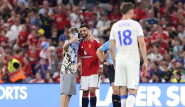 Pitch invaders take selfies with Bruno Fernandes during Manchester United friendly
