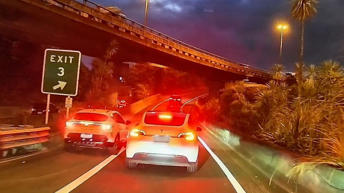 Dashcam footage shows car reversing towards missed exit at Auckland’s Spaghetti Junction