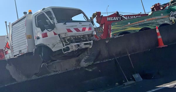 Photos show truck smashed through barrier on Auckland motorway