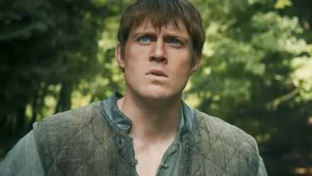 Dunk the Tall looking up at something with his brows furrowed in A Knight of the Seven Kingdoms.