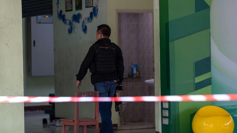 A police officer secures Debsirin Nonthaburi School, where a shooting killed several people in Thailand's Nonthaburi province, Friday, August 7, 2026.