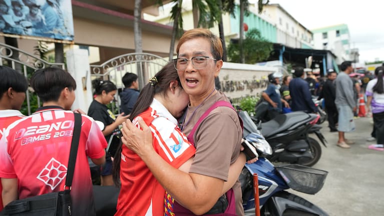 A schoolgirl cries outside her school where deaths and injuries were reported after a shooting in Thailand's Nonthaburi province, Friday, August 7, 2026.