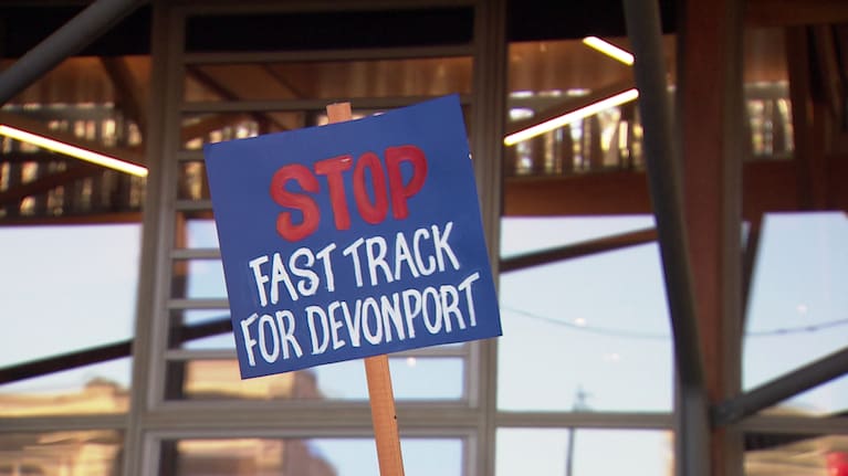 A sign at Sunday's protest reads 'Stop Fast Track For Devonport'.