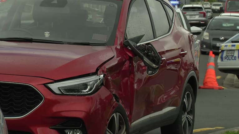 A vehicle damaged following a crash with an e-motorcycle in Auckland's Flat Bush.