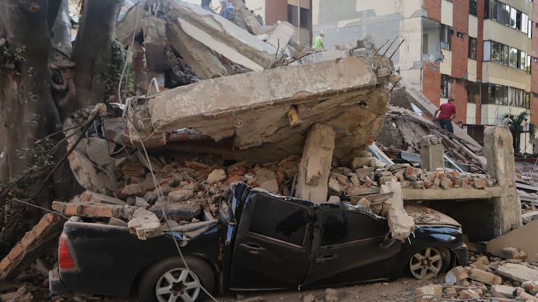 A vehicle is crushed by debris after an earthquake struck Cali, Colombia