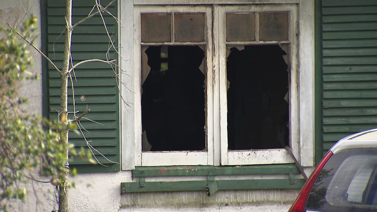 A witness said the house was engulfed in flames within seconds.