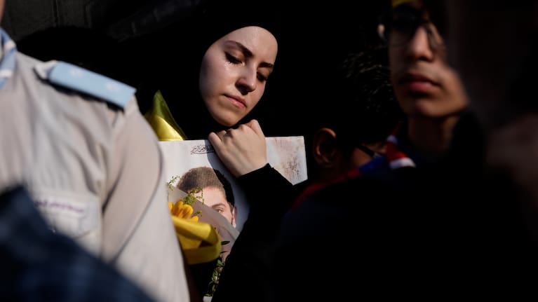 A woman mourns during the funeral of Hezbollah member Ali al-Haj Hassan, his wife and four children who were killed the previous day by an Israeli airstrike.