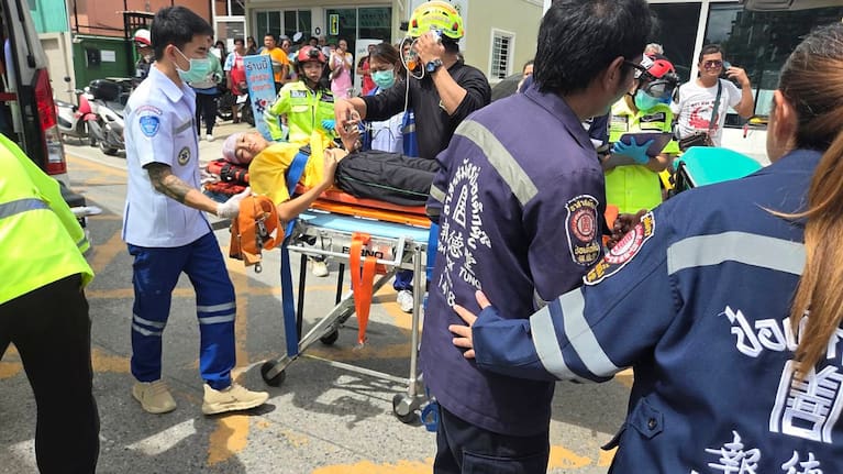 An injured person is carried on a stretcher after a school shooting in Thailand's Nonthaburi province, Friday, August 7, 2026.