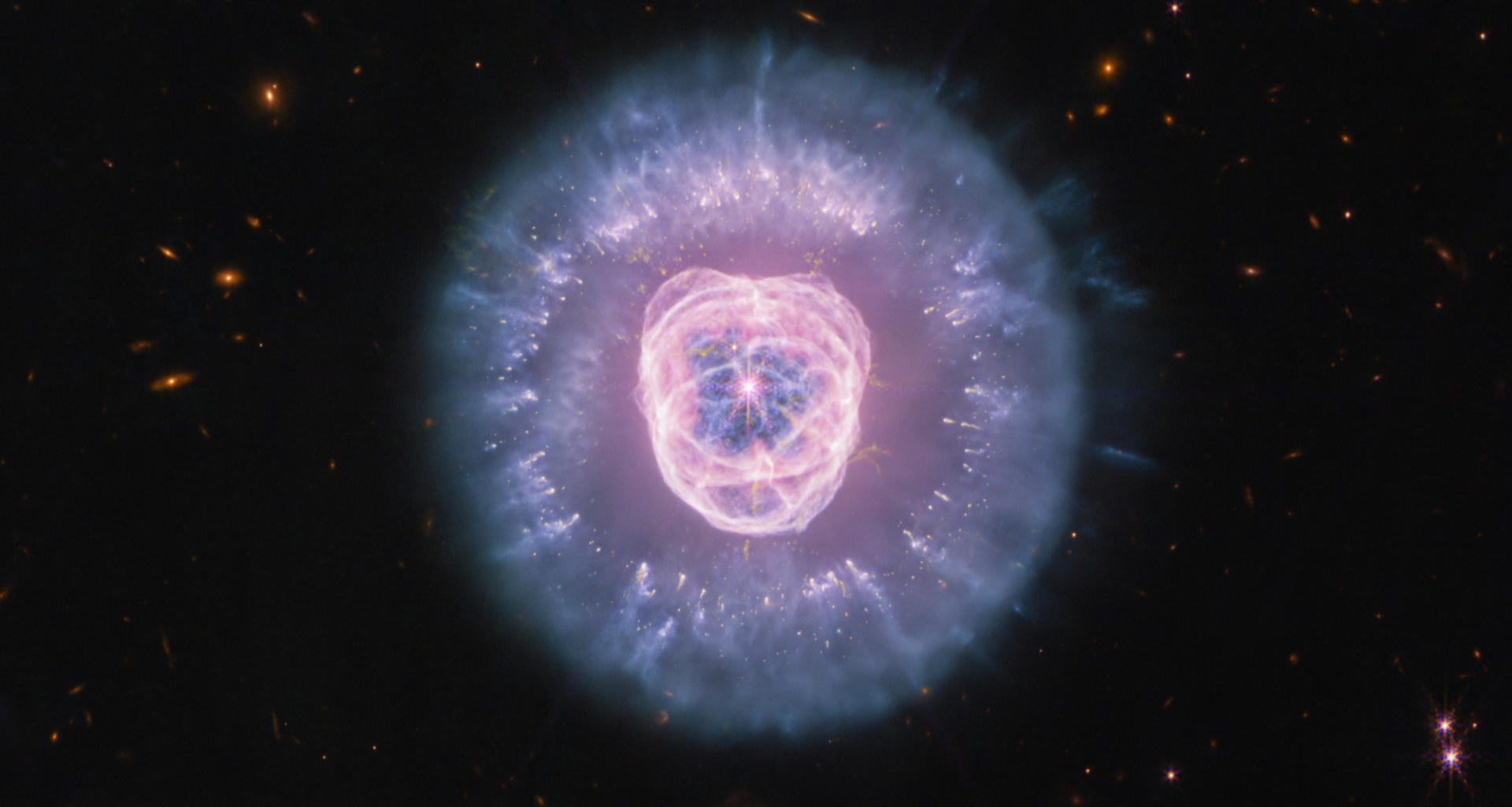 A purple bright center is surrounded by darker purple and blue bright light.