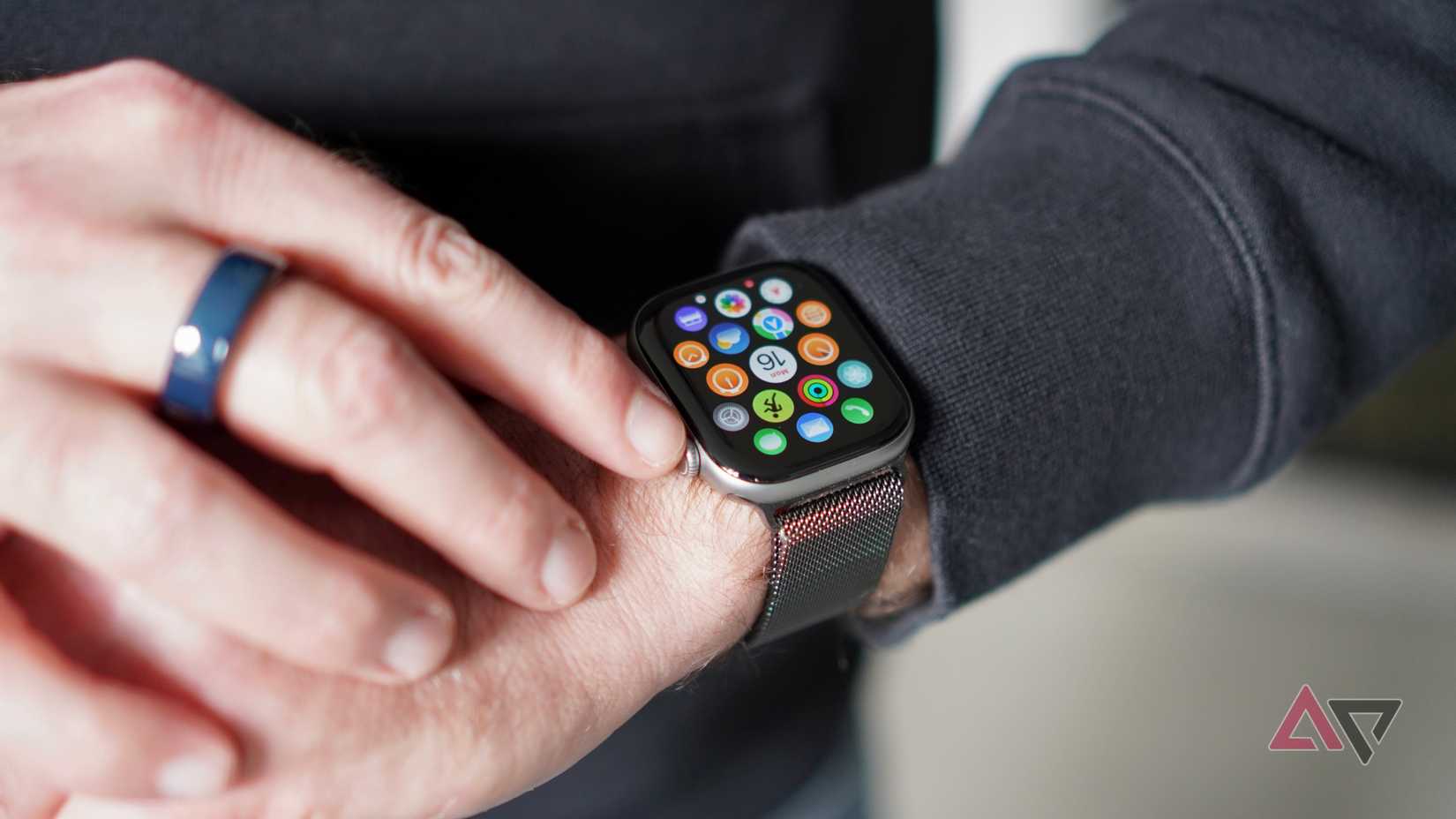 A person wearing the Apple Watch Series 11 showing the apps screen