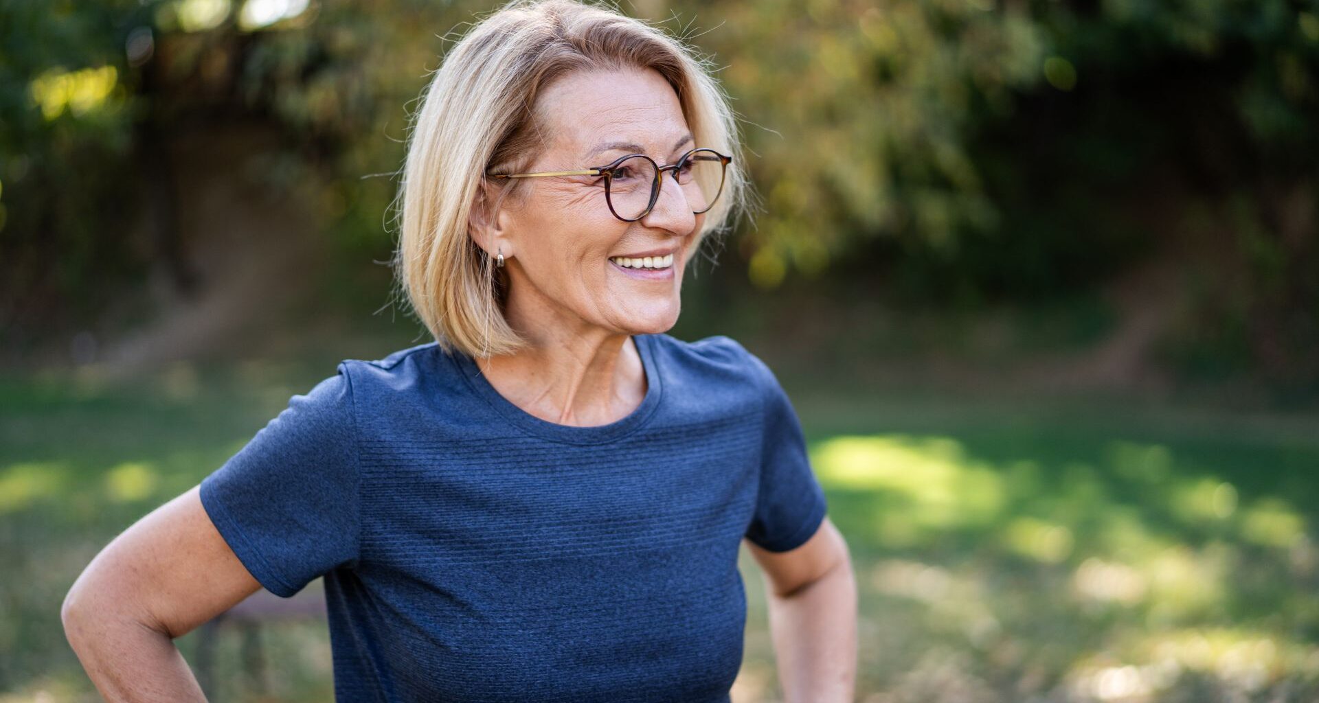 Woman smiling after doing Penn State 4-minute workout