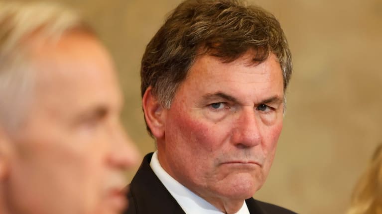 Canada-US Trade Minister Dominic LeBlanc listens as Prime Minister Mark Carney speaks about Canada's response to new US tariffs during a news conference on Parliament Hill in Ottawa on Saturday, August 22, 2026.