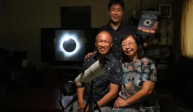 (Clockwise from bottom left) Koh Joo Beng, his wife Janet Tay and their son Jared with a photograph of a total solar eclipse with a “diamond ring” effect, which the elder Koh took in Western Australia in 2023. 