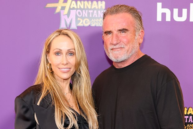 Tish Cyrus and Dominic Purcell attend the World Premiere of Disney+’s “Hannah Montana 20th Anniversary Special” at El Capitan Theatre on March 23, 2026 in Los Angeles, California