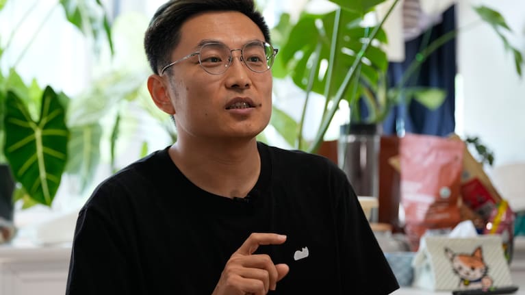 Fei Zhaojun, a former software engineer speaks during an interview at his home in Beijing