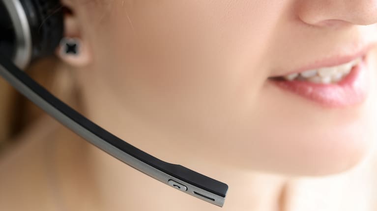 A person speaking on a headset (file image).