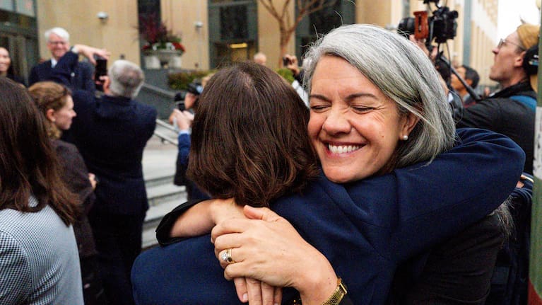 Colorado Solicitor General Shannon Stevenson, right, hugs a colleague outside of court after tech giant Meta agreed to pay $17 billion as part of a settlement to end a landmark trial over teen social media addiction.