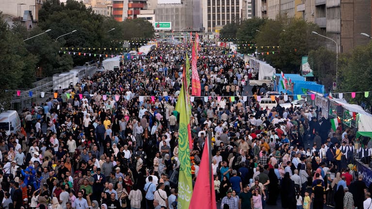 Crowds fill a street during celebrations marking Prophet Muhammad's birthday in Tehran, Iran, Sunday, August 30, 2026.