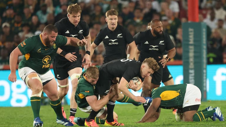 Damian McKenzie is brought down by the Boks at Ellis Park.
