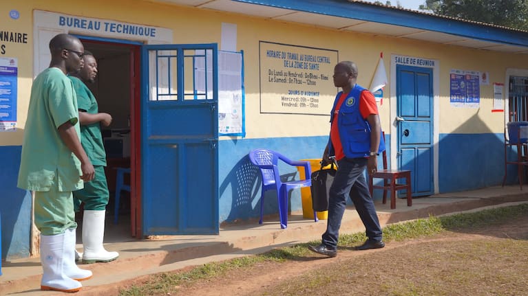Ebola healthcare workers arrive at their office in Nizi, Congo.
