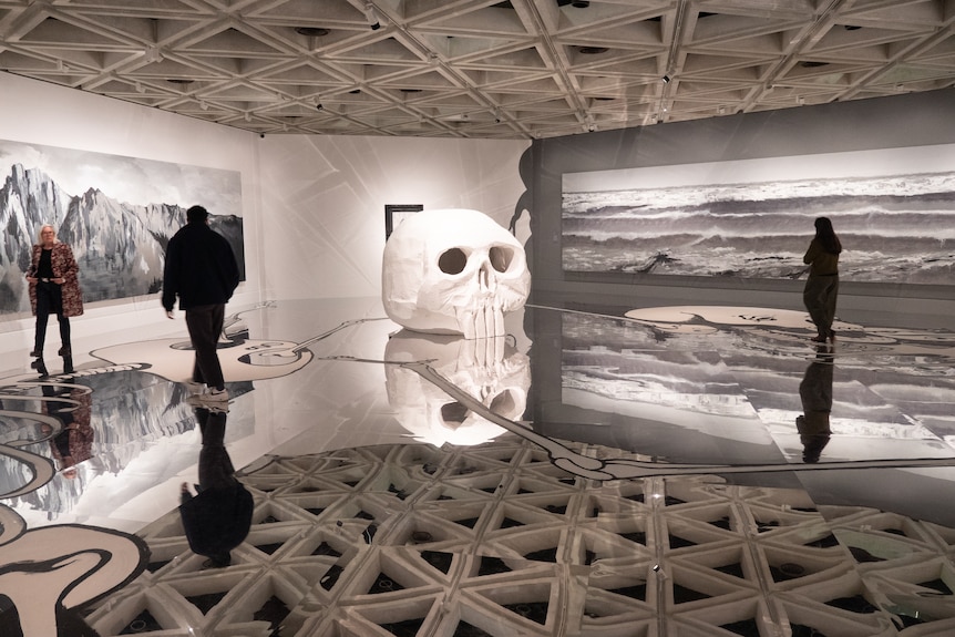 Abstract art in a gallery of a mirrored floor