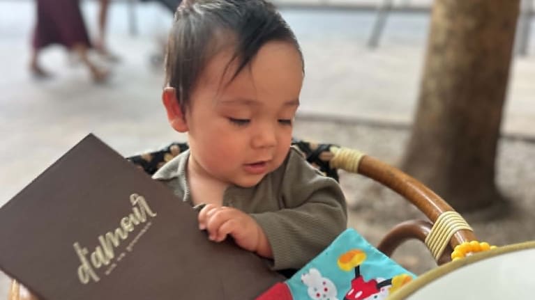 At just nine months, Eiden is enjoying the cafe scene in France with his mum.