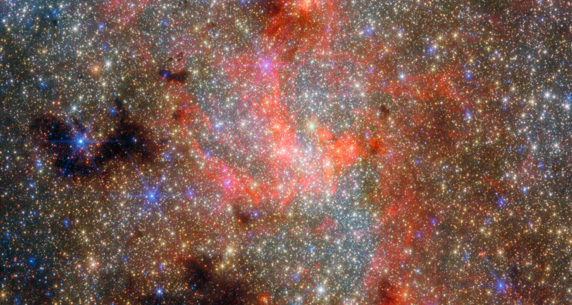NASA’s James Webb Space Telescope detected water molecules and freshly produced silicate dust around a dying star seen just 0.55 light-years in projection from the Milky Way’s central black hole—showing that surprisingly fragile material can form and survive within the Galaxy’s radiation-drenched central environment.