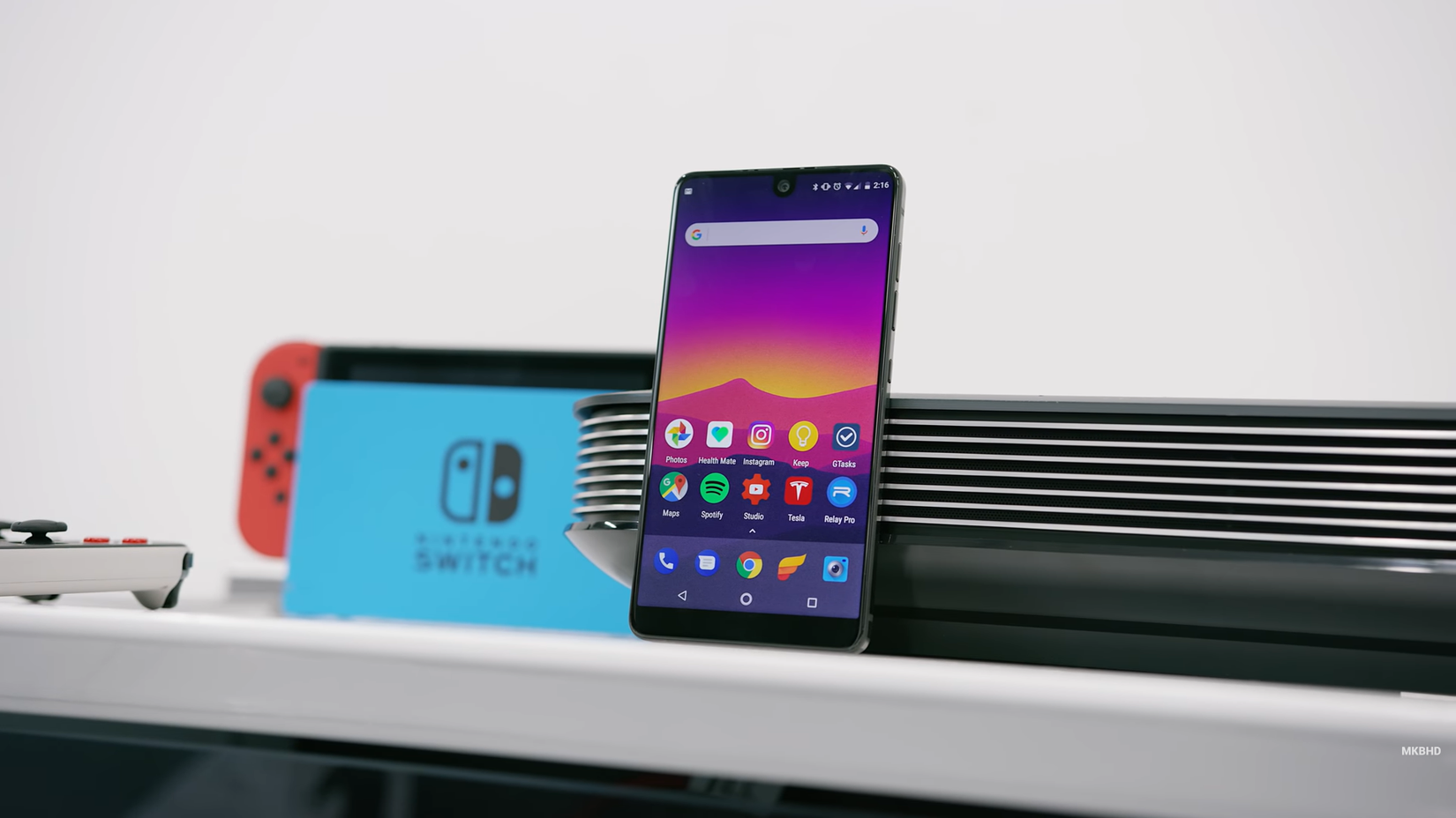 Essential phone standing with Nintendo Switch background