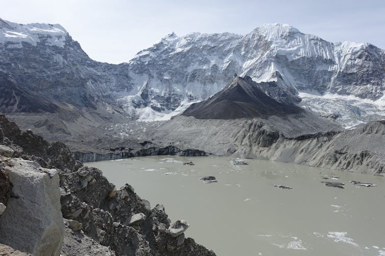 A shot from above of an ice dammed lake in the Himalayas.
