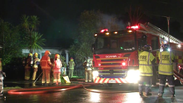 Fire crews battled a house fire in Auckland's Henderson on Saturday night.