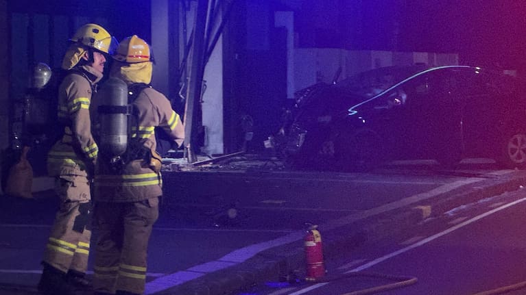Firefighters at the scene of a crash in Auckland.