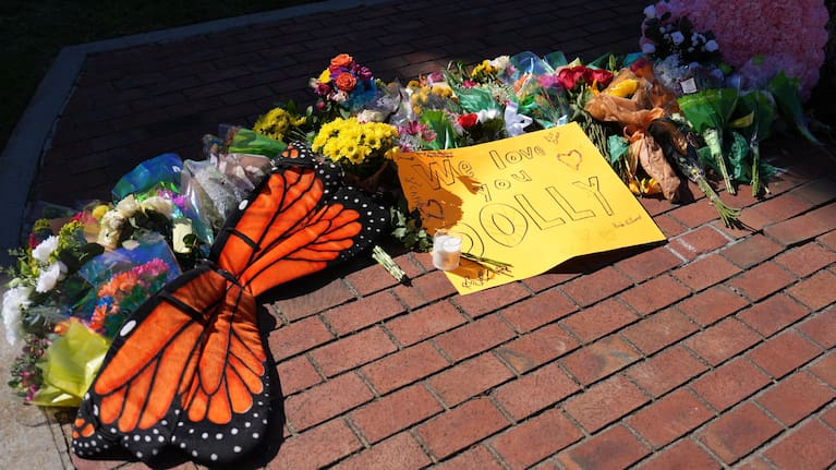 Flowers and monarch butterfly wings form part of a makeshift memorial honoring Dolly Parton in Sevierville, Tennessee, Tuesday, August 25, 2026.
