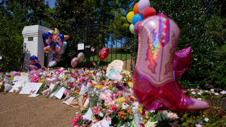Flowers, cards and balloons are seen at a memorial outside the home of the late Dolly Parton, Thursday, August 27, 2026, in Brentwood, Tennessee.