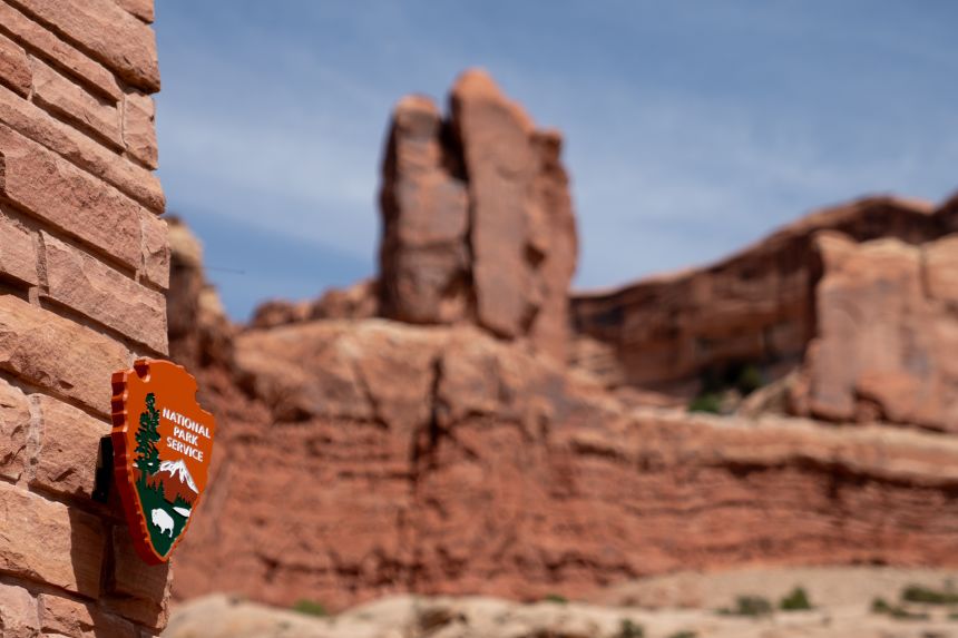 A National Park Service sign outside Arches National Park in Moab, Utah, on May 17, 2025.