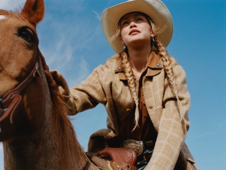 Photo of Gigi Hadid on a horse for new Guest In Residence campaign