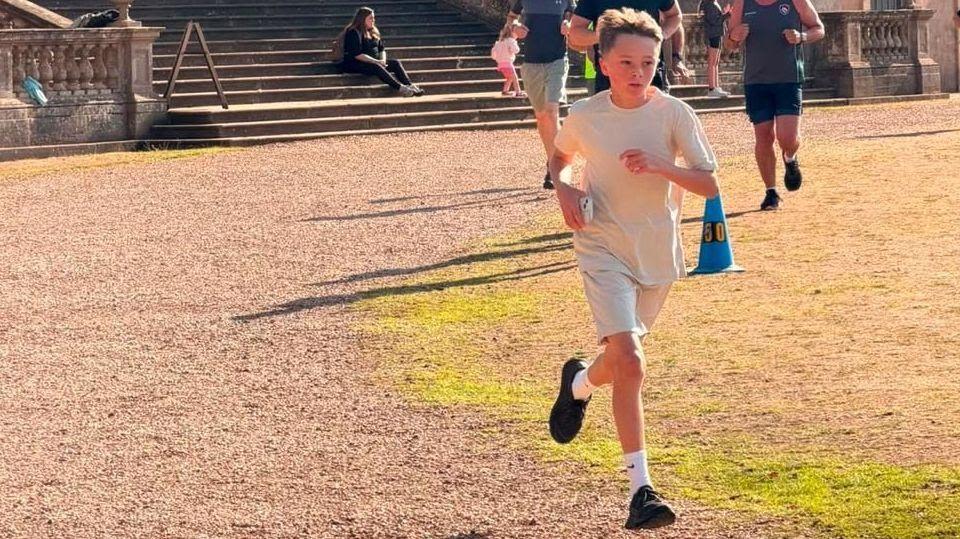 Boy takes on run challenge for teacher with cancer