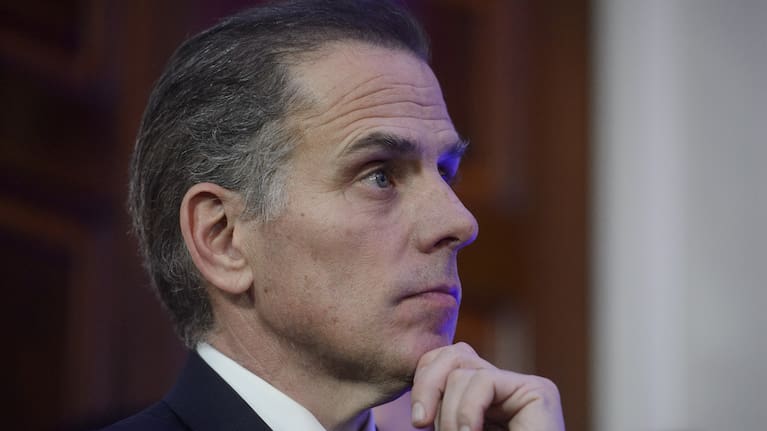 Hunter Biden listens while his father, President Joe Biden, speaks during a Hanukkah reception in the East Room of the White House in Washington, Dec. 16, 2024.