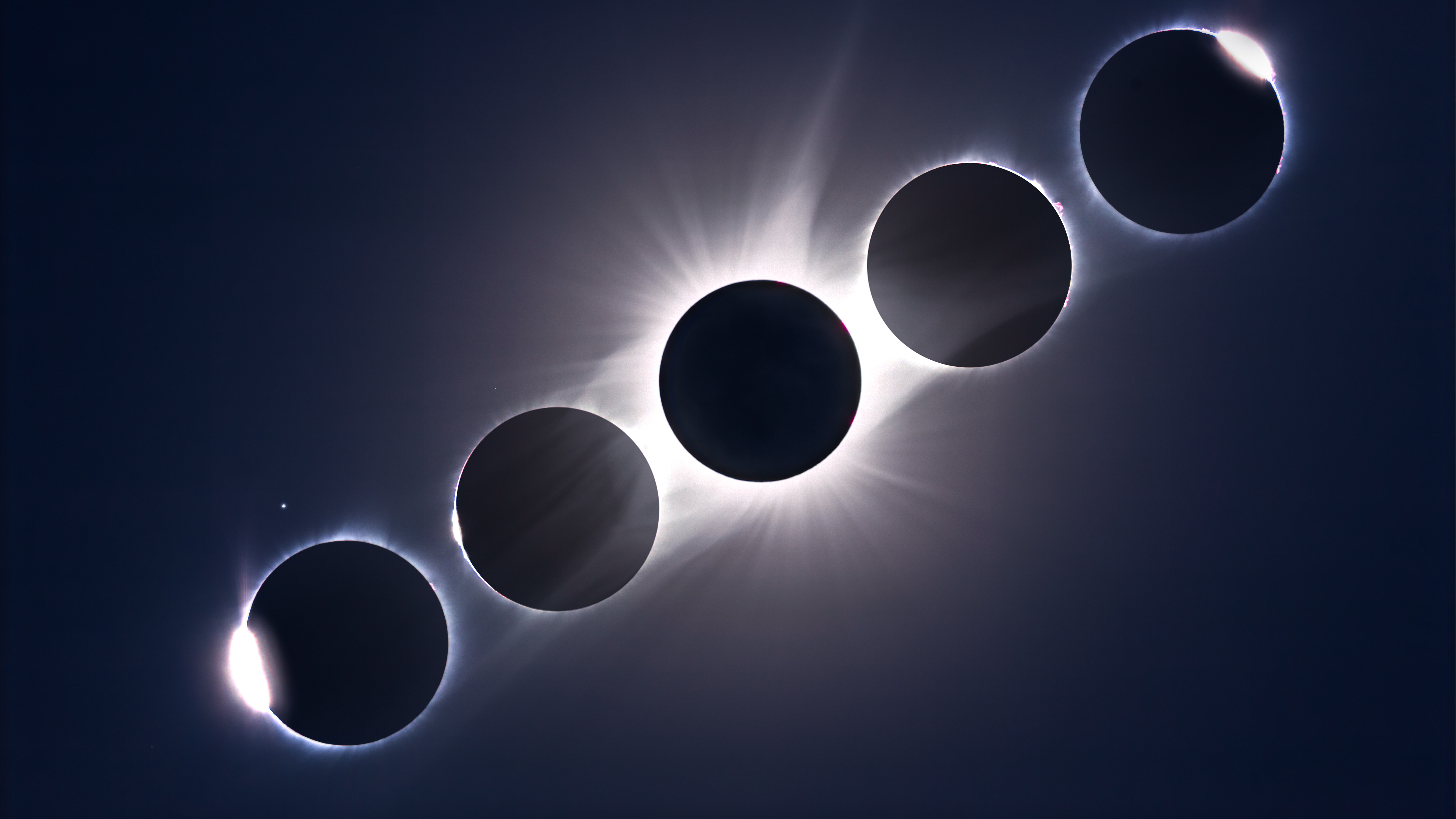 A composite of the August 21, 2017 total eclipse of the Sun, showing the second and third contact diamond rings and Baily&rsquo;s Beads at the start left and end right of totality, flanking a composite image of totality itself The diamond ring and Baily&rsquo;s Beads images are single images The totality images is a blend of 12 exposures from 1/1600 sec to 1 second, stacked as a smart object and combined using the Mean stack mode to blend the images Several High Pass filter layers were added to sharpen and increase the contrast in the coronal structures Regulus is the star at lower left Placement of the images only roughly matches the actual position and path of the Sun across the sky However, the time sequence runs from left to right All taken through the 106mm Astro-Physics Traveler refractor with a 085x reducer/flattener, yielding f/5 at 500mm focal length, wide enough to capture Regulus at left All with the Canon 6D MkII camera at ISO 100 Shot from a site in the Teton Valley, Idaho, north of Driggs. (Photo by: Alan Dyer/VW Pics/UIG via Getty Images)