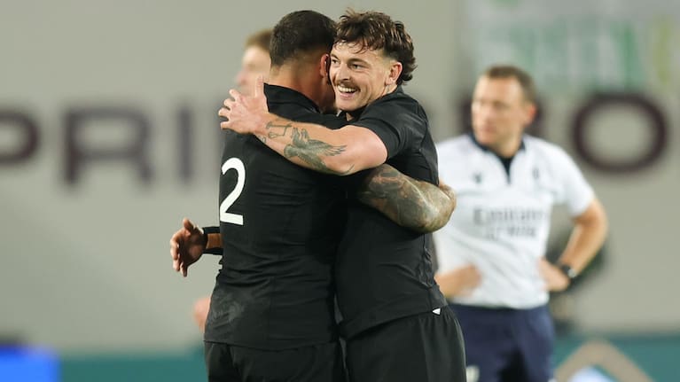 Leroy Carter, right, and Codie Taylor celebrate the All Blacks' win over South Africa.