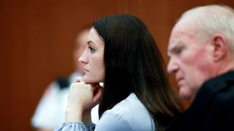 Lindsay Clancy and her attorney, Kevin Reddington, listen to testimony from Rebecca Jollotta during Clancy's murder trial in Plymouth, Massachusetts. (Source: Jonathan Wiggs/The Boston Globe via AP, Pool)