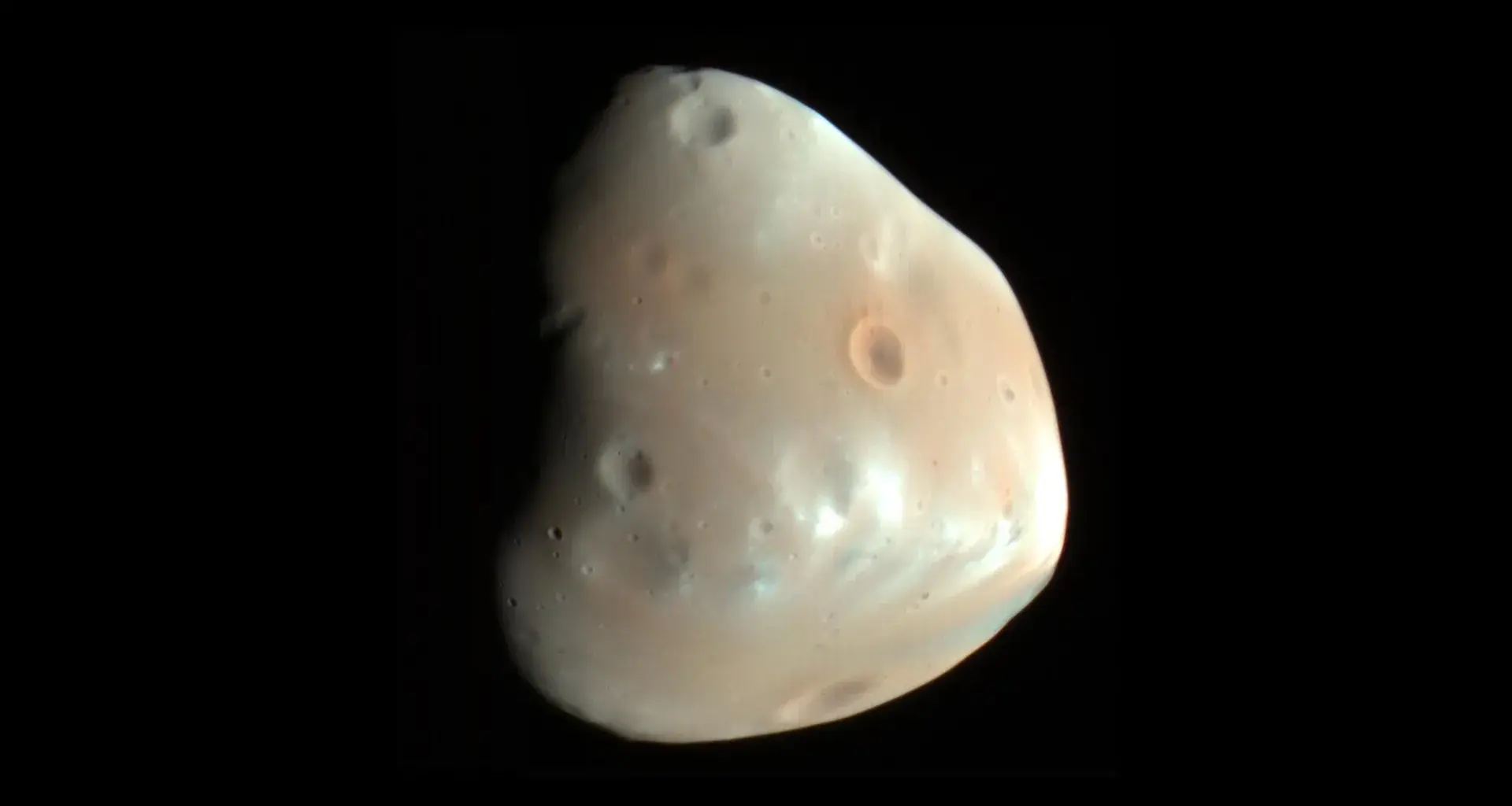 One asteroid strike may explain two mysteries of Mars’ moon Deimos