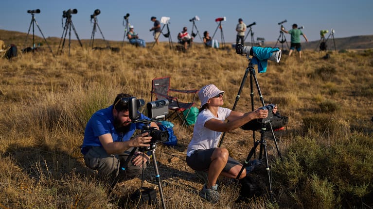 Members of the "Los Taraos" amateur astrophotography group, set up cameras to shoot a total solar eclipse in Berlanga de Duero, central Spain.
