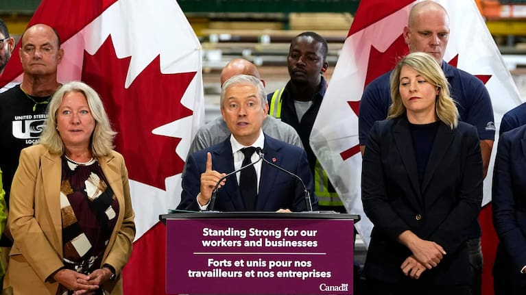 Minister of Finance and National Revenue Francois-Philippe Champagne speaks at a news conference on Canada's response to US tariffs, at a roofing company in Ottawa, on Tuesday, August 25, 2026.