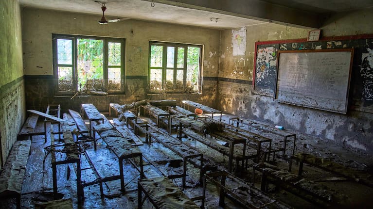 Mud covers a classroom at the Shree Bagheswori Madhyamik School, damaged in Nepal flash flooding.