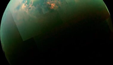 Titan is wider than Mercury, operates a complete methane weather cycle, and contains hundreds of times more liquid hydrocarbons than all Earth’s known oil and gas reserves. It is the only known world beyond Earth where you could stand beneath clouds beside a calm lake—provided you remained sealed inside a heated, oxygenated suit.